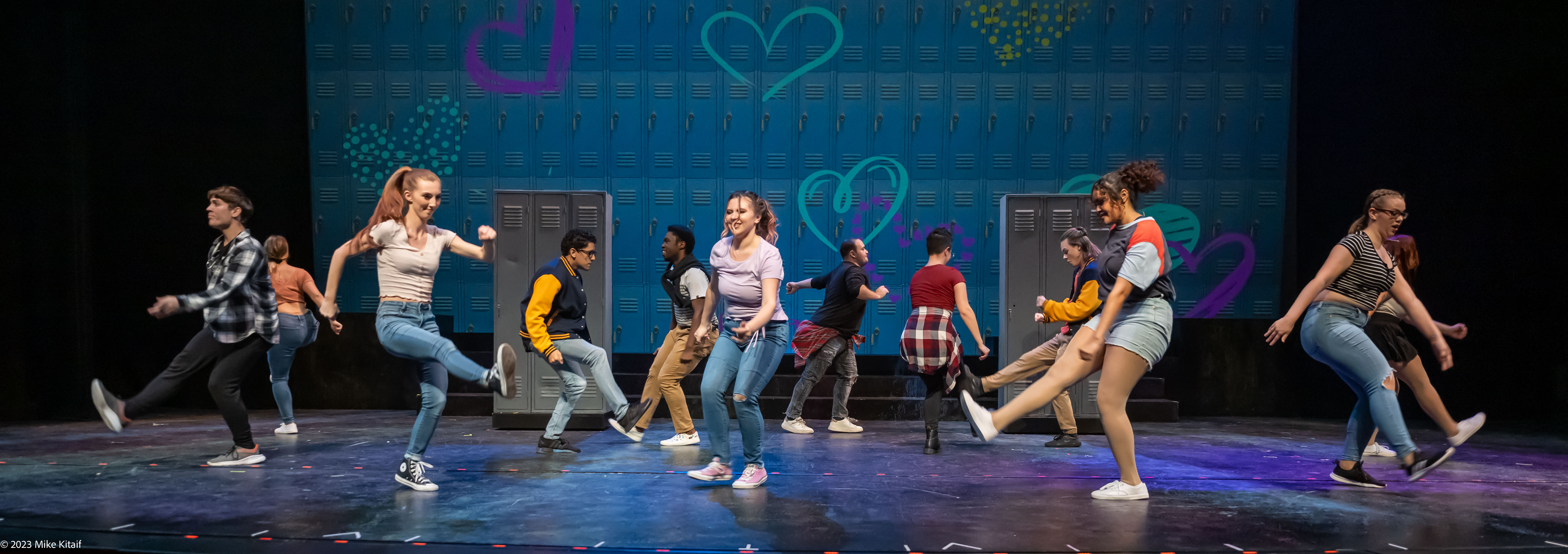 students on stage performing Avenue Q