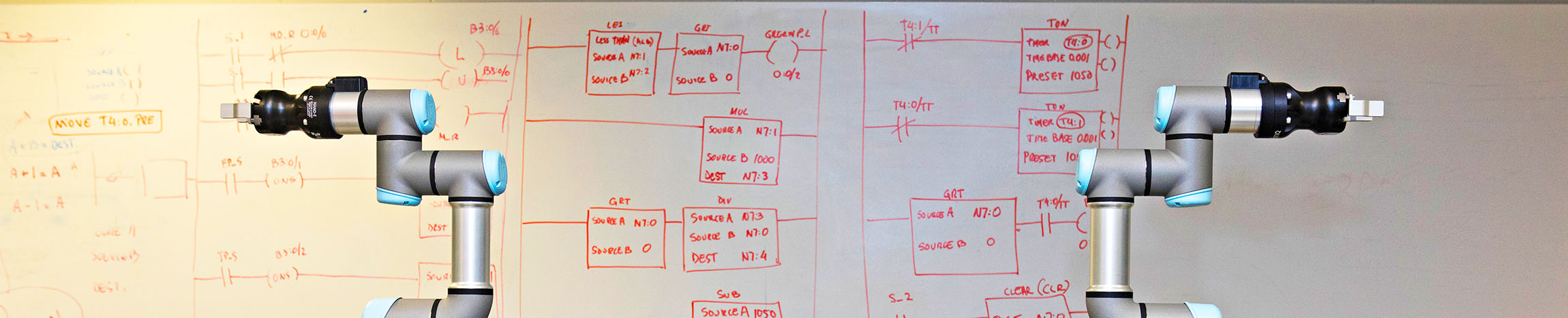 machine in front of whiteboard with equations