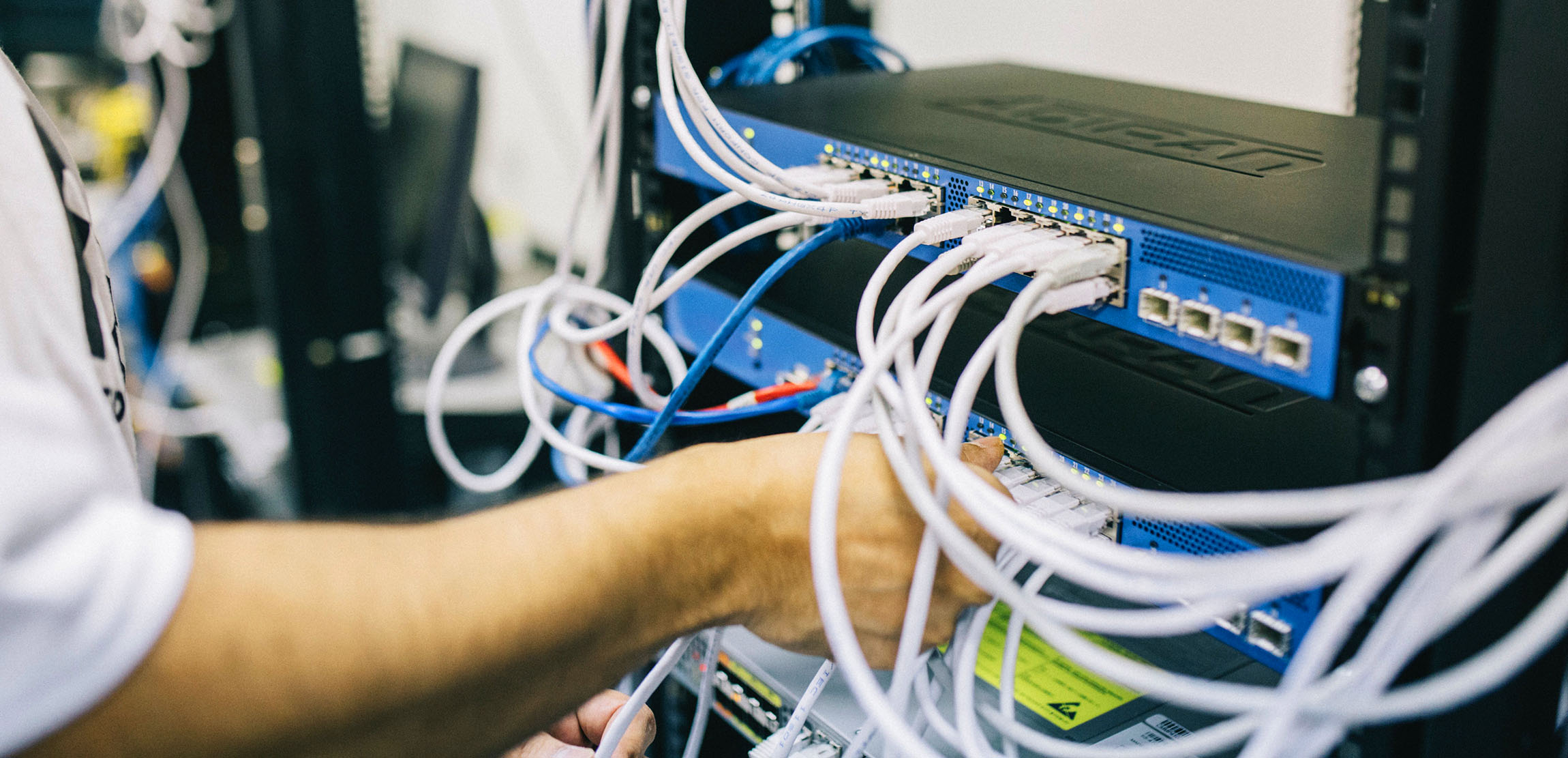 Close up of many wires and computer ports.