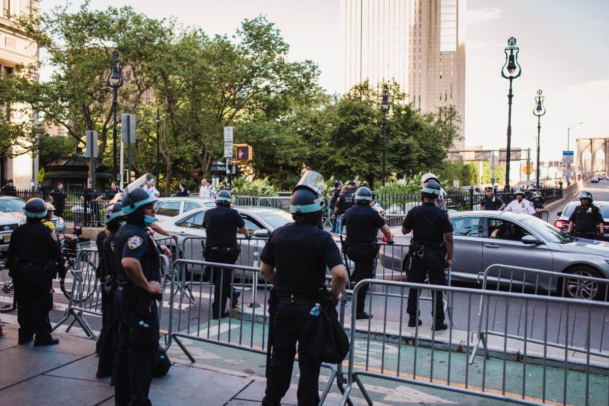 multiple law enforcement officers outside on the street