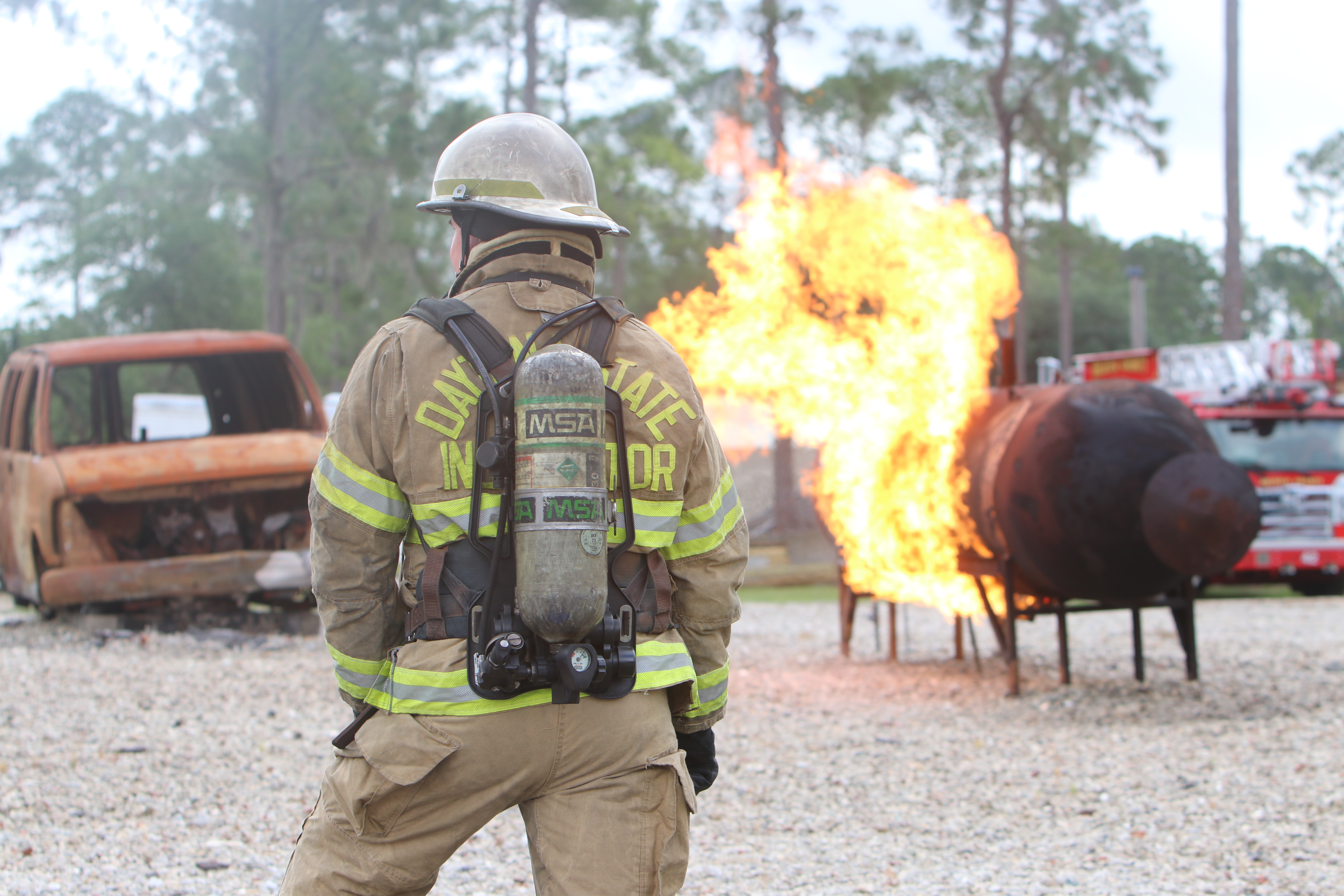 Fire fighters fighting a car on fire