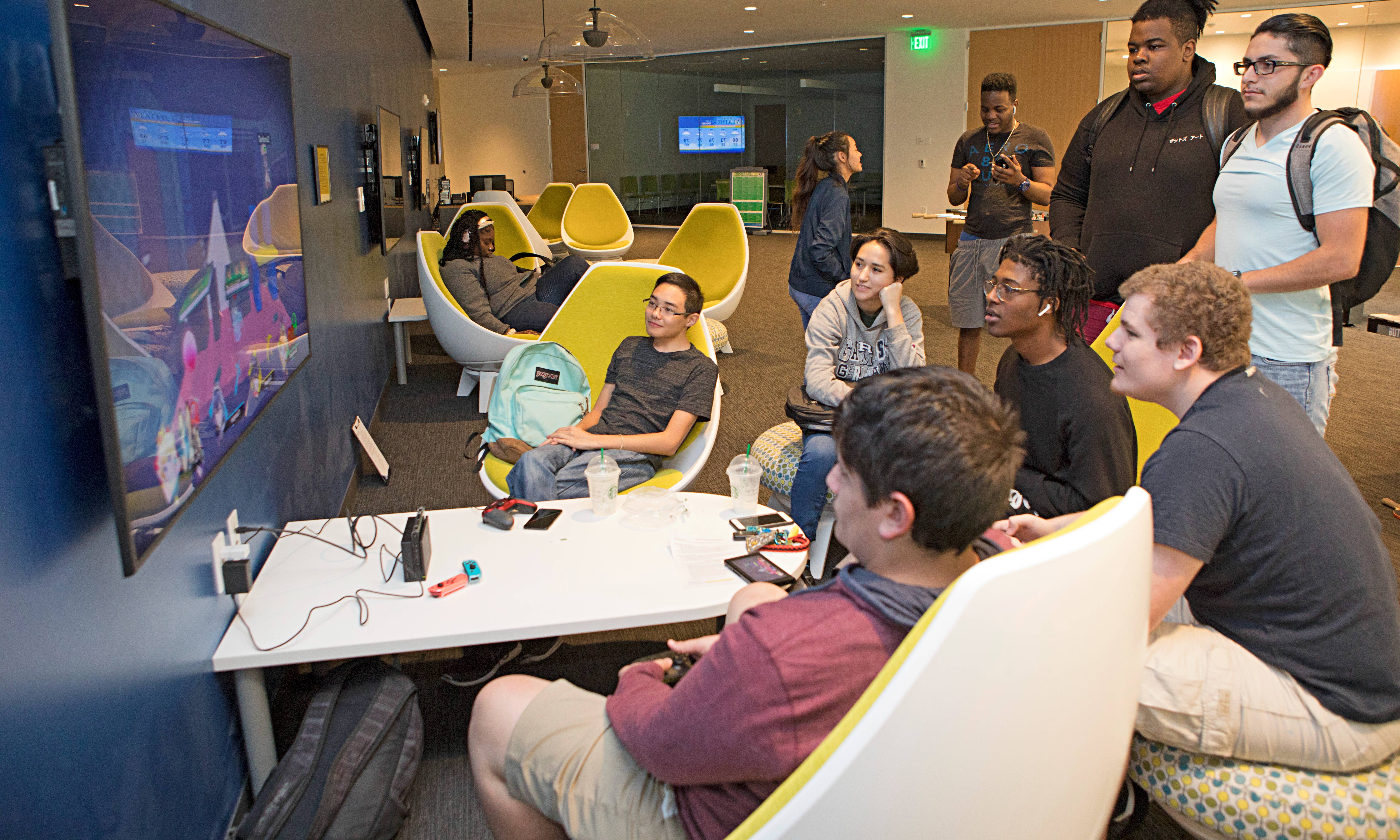 students playing a video game in lemerand student center
