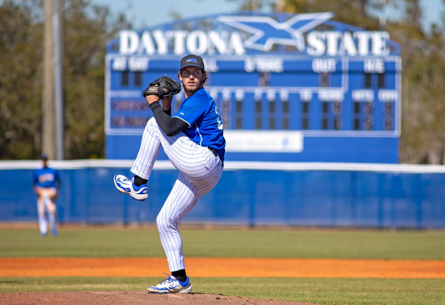 Baseball pitcher gets ready to throw the ball. 