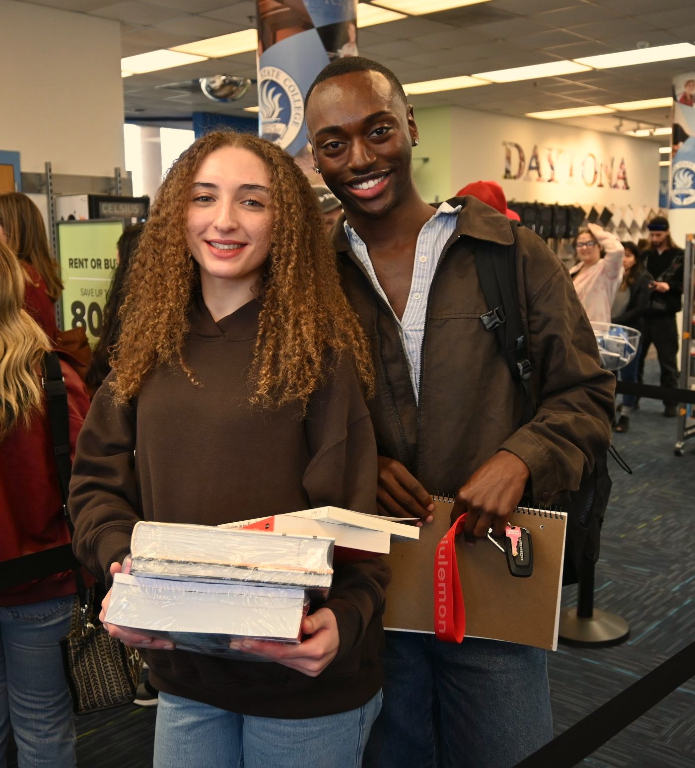 Two cosmetology students outside the Lemerand Student Center.