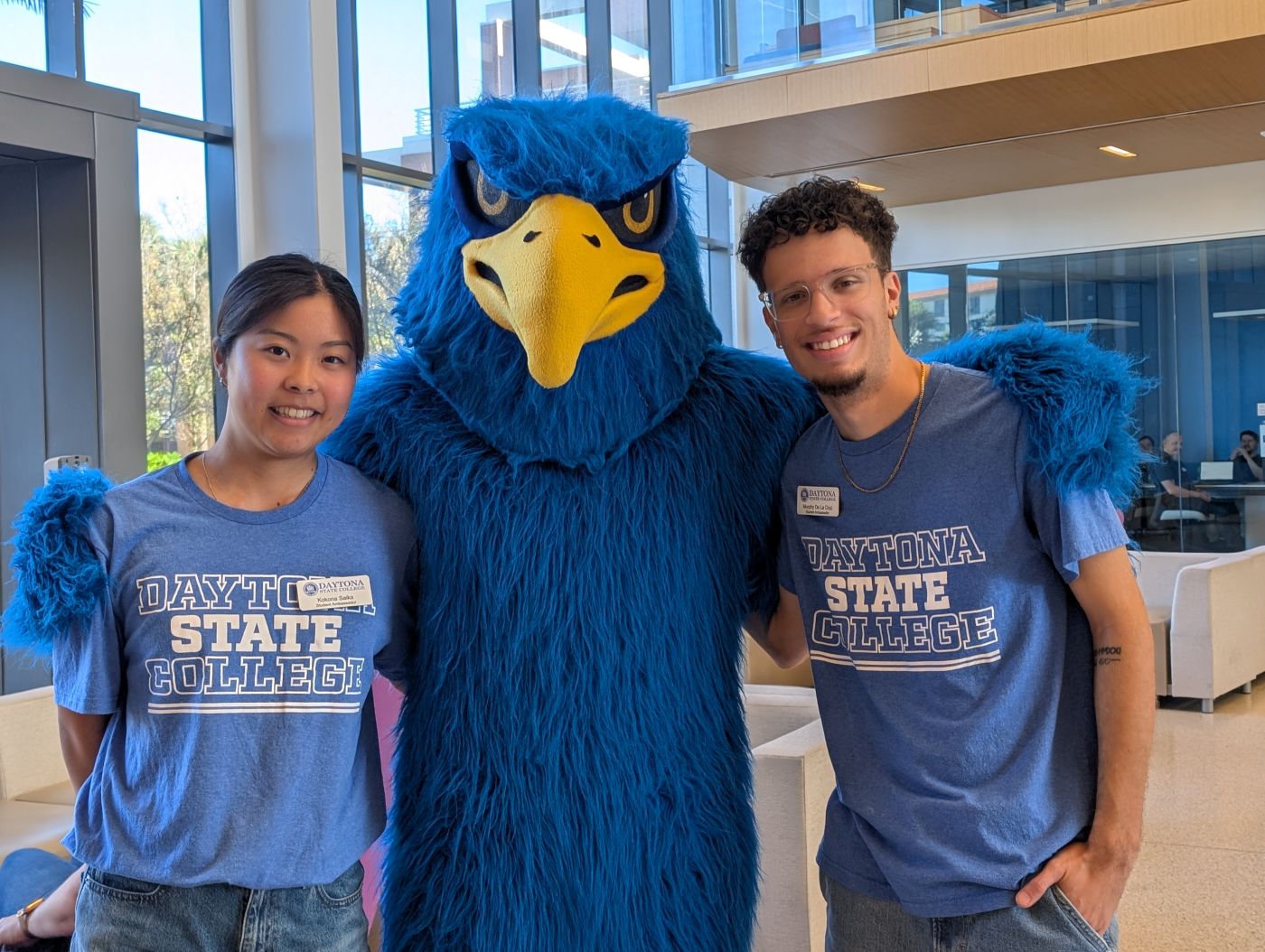 Freddie posing with two student ambassadors in the Lemerand Student Center. 