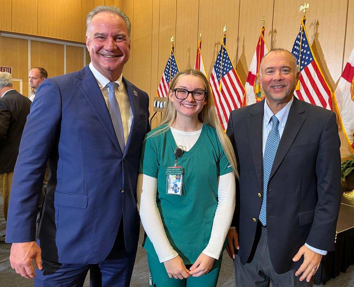 Second year Nursing student and Halifax Health monitor tech Alexis Marie Shay with Daytona State College President Dr. Tom LoBasso (right) and Halifax Health President and CEO Jeff Feasel.