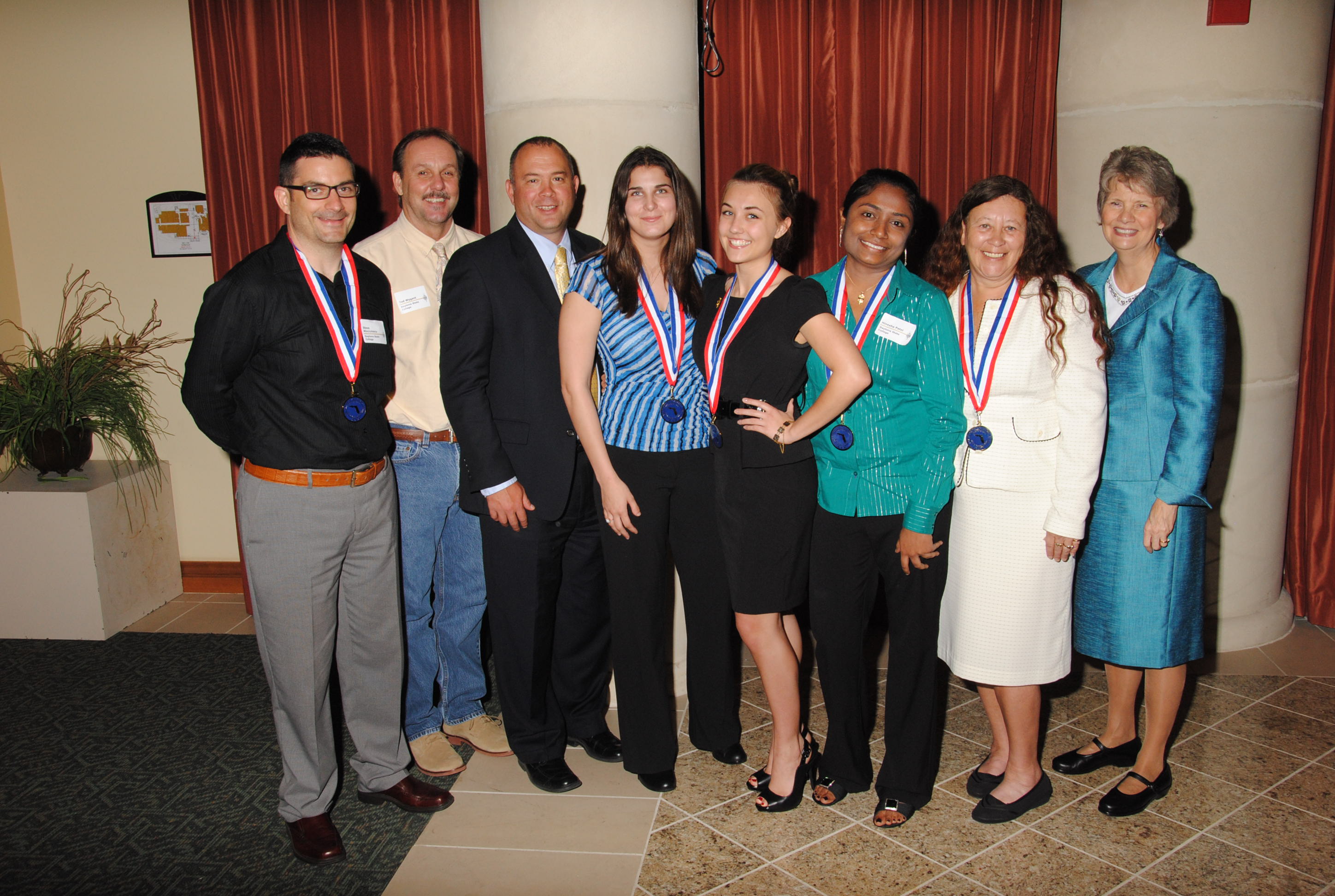 Left to right, student Steve Minciulescu, PTK faculty advisor Ted Wygant, Thomas LoBasso/senior vice president for student development & institutional effectiveness, students Elizabeth Strople, Jenna Zuyus, Hinesha Patel, Charlene Maine and President Carol W. Eaton 