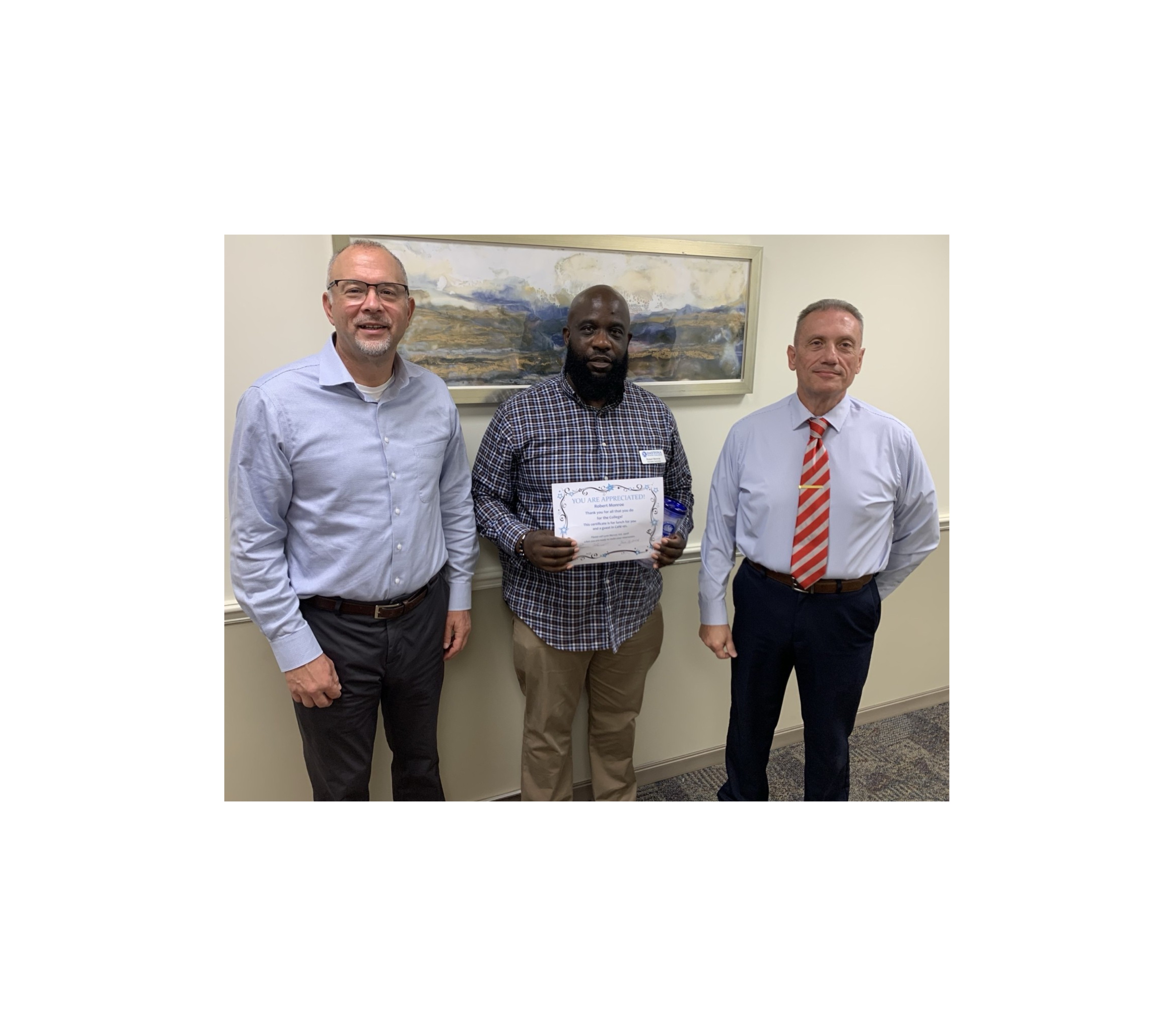 Outstanding employee Rober Monroe and administrators. 
