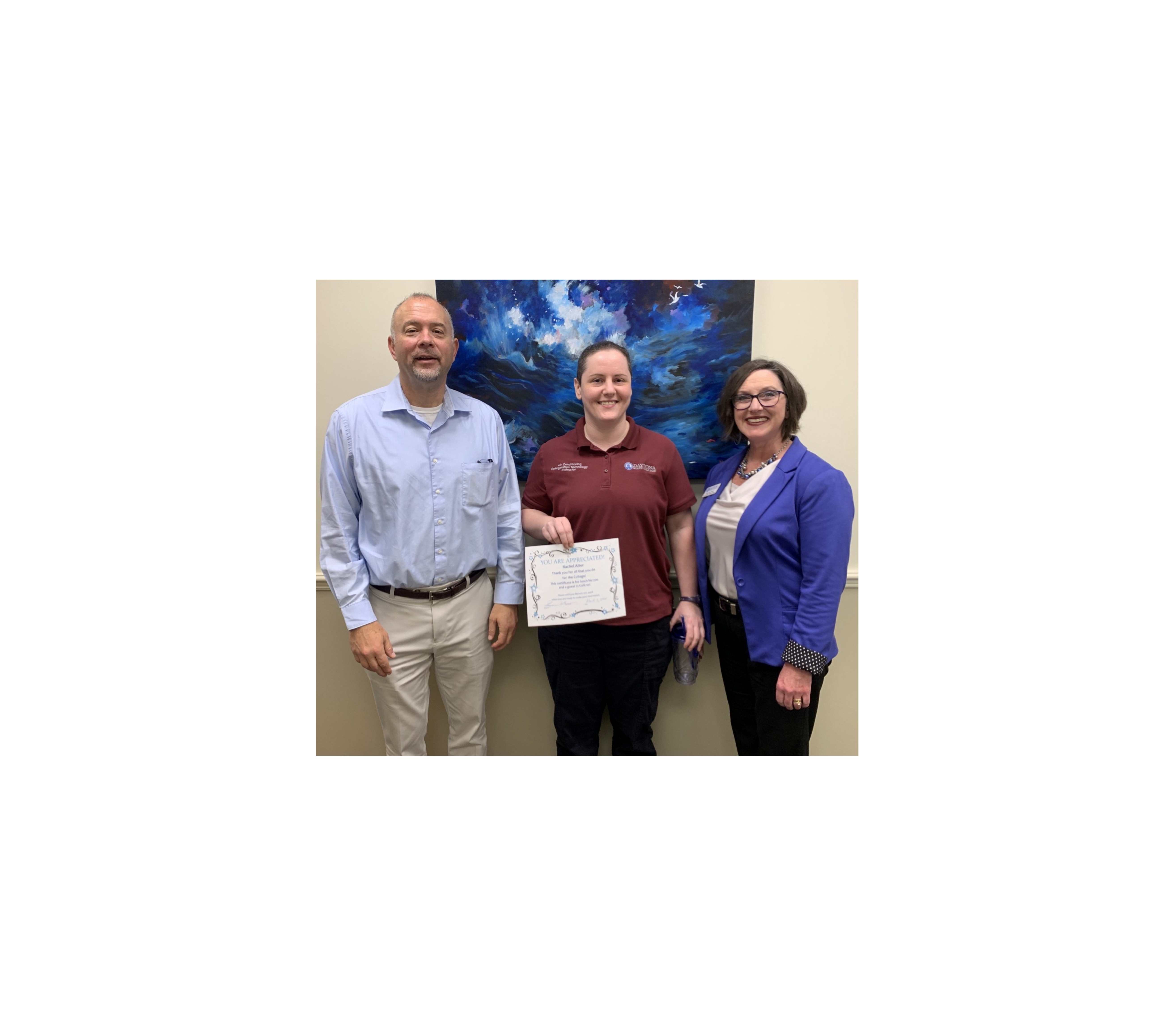 Outstanding employee Rachel Alter and administrators. 