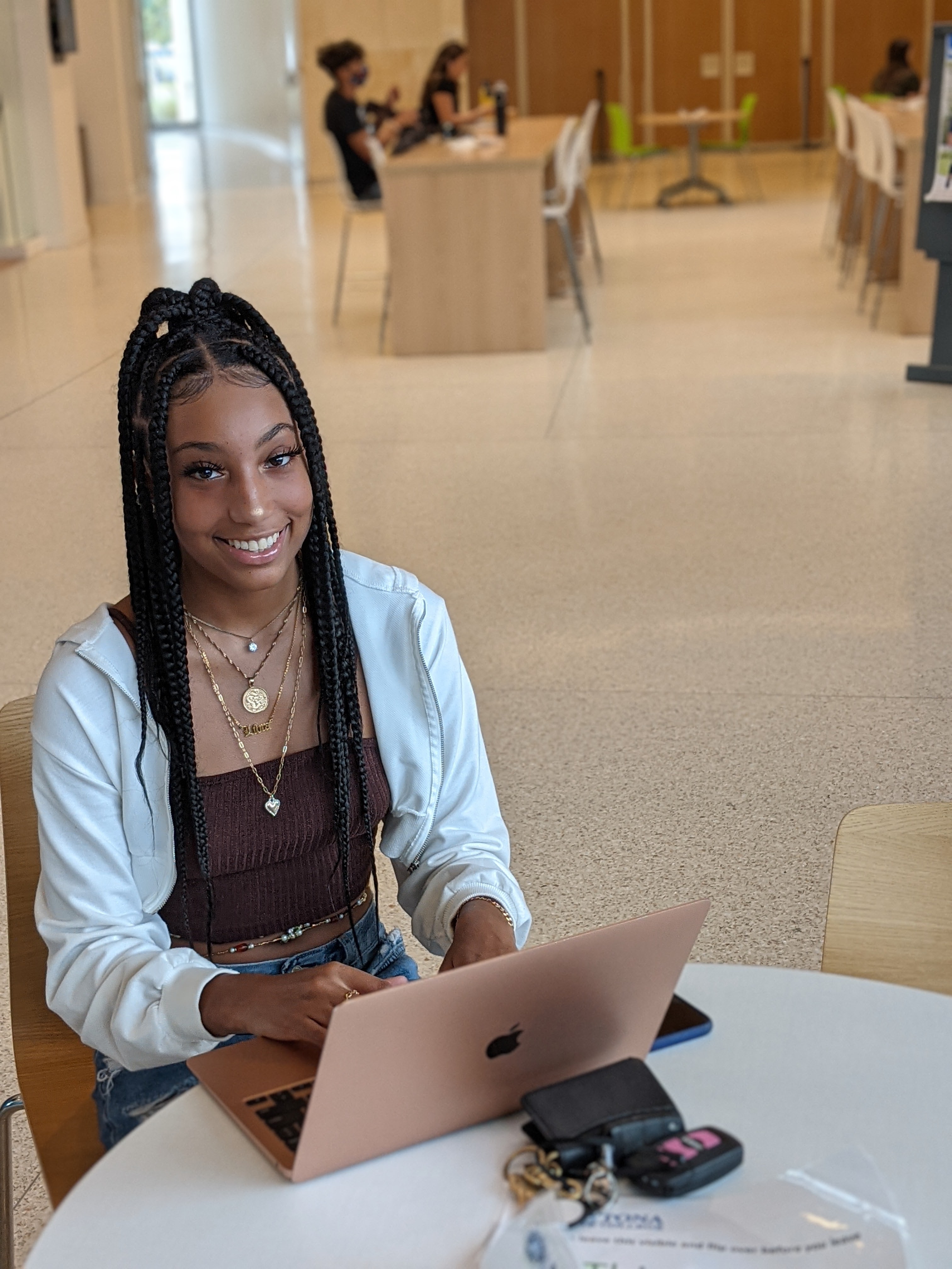 Student using a laptop in the student center