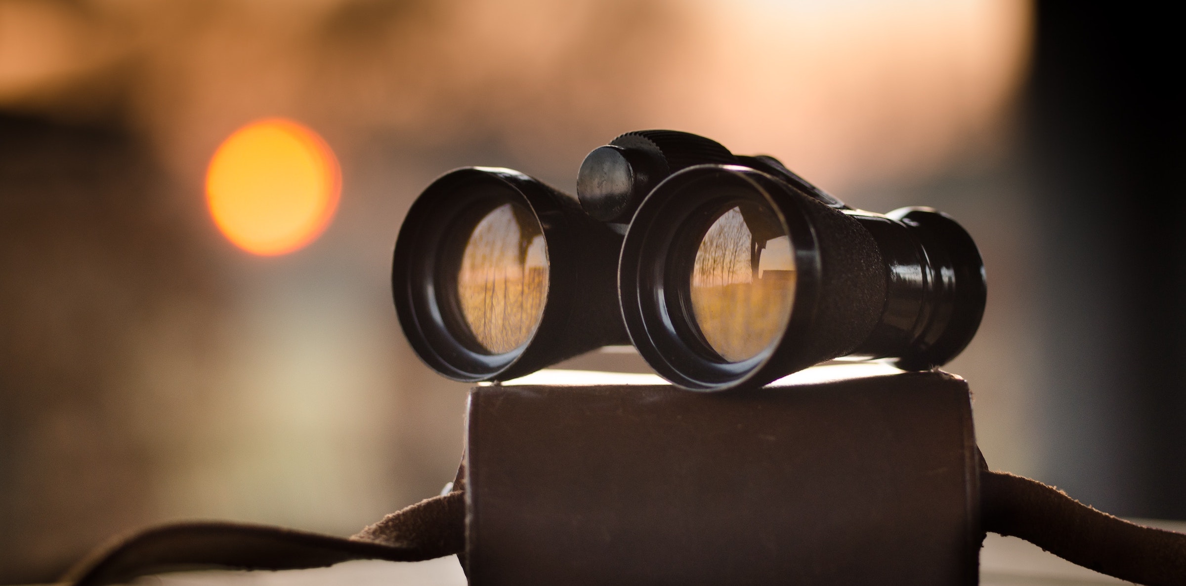Binoculars sitting on a table.