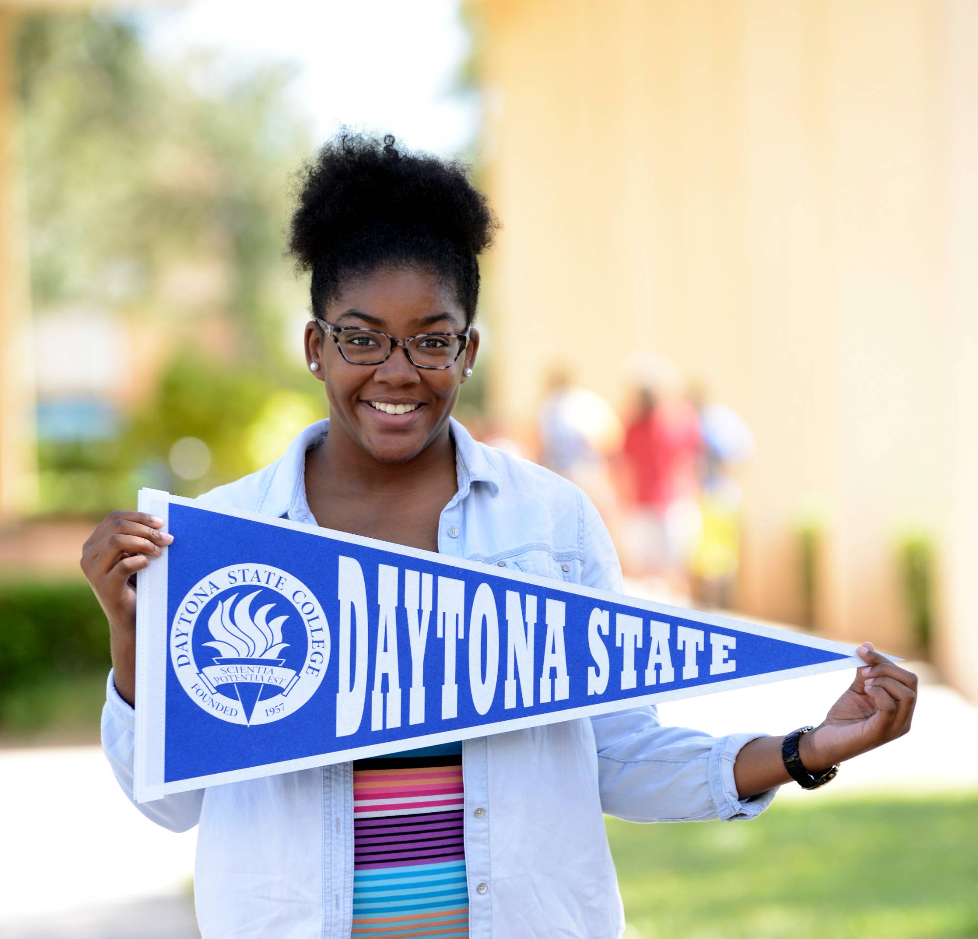 Student holding a DSC banner