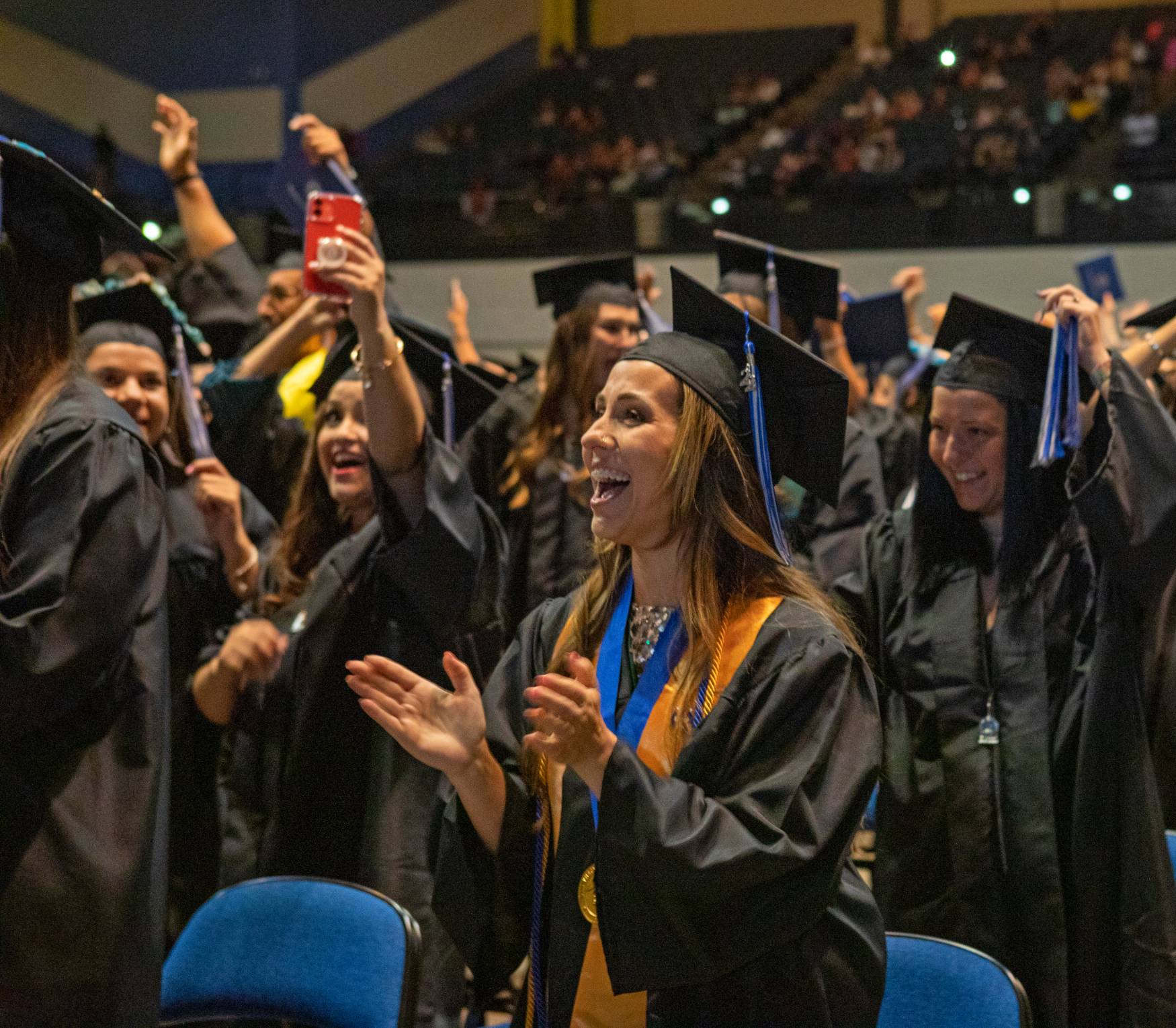 students taking a selfie at graduation