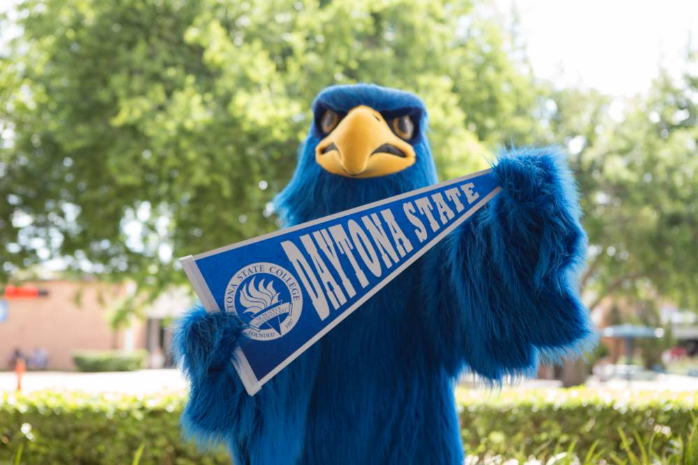 Freddie Falcon holding DSC pennant 